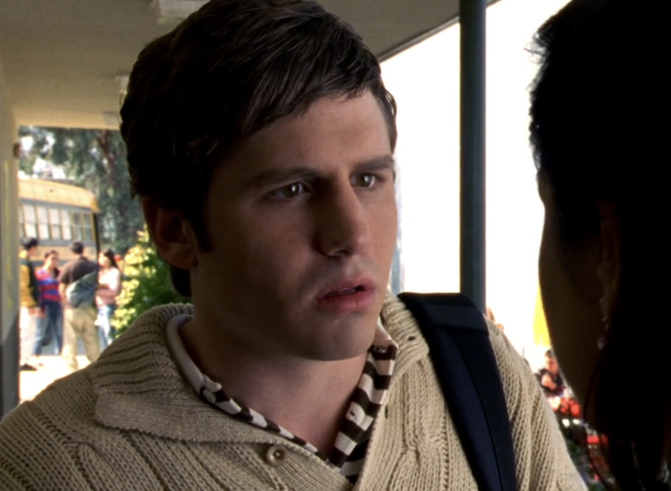 Screenshot from S1E20 of Veronica Mars. A closeup on Tad's face. His mouth is open and he's staring intently at Carmen who is offscreen.
