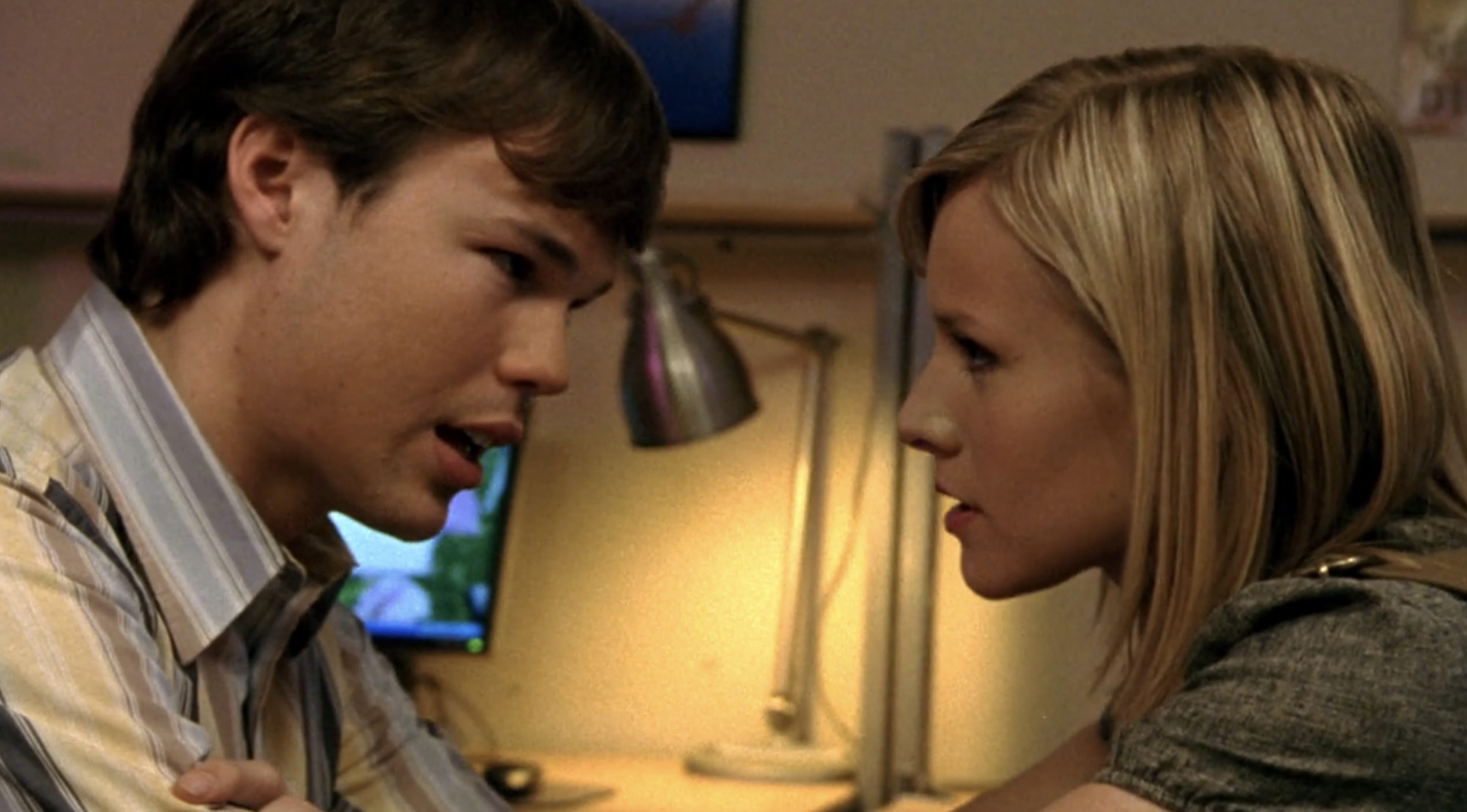 Screenshot from S1E21 of Veronica Mars. Veronica and Sean are sitting close to each other, almost forehead to forehead having an intense conversation.